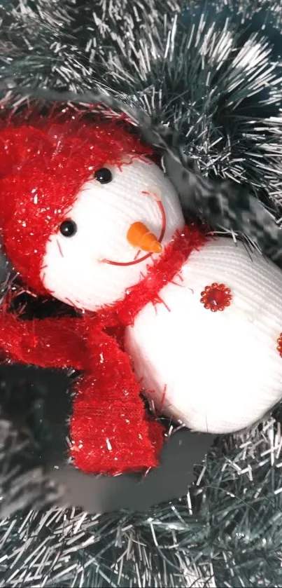 Charming snowman with red hat, scarf, and festive tinsel.