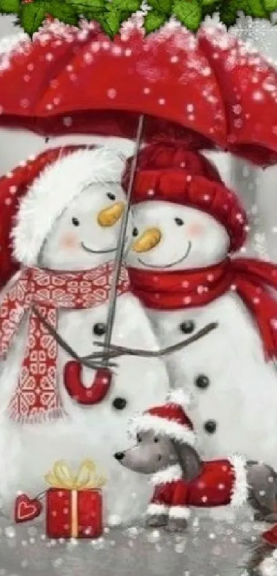 Snowman couple under red umbrella with snow.