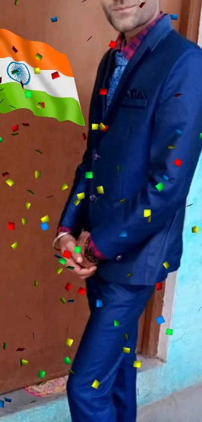 A man in a blue suit with Indian flag and colorful confetti.