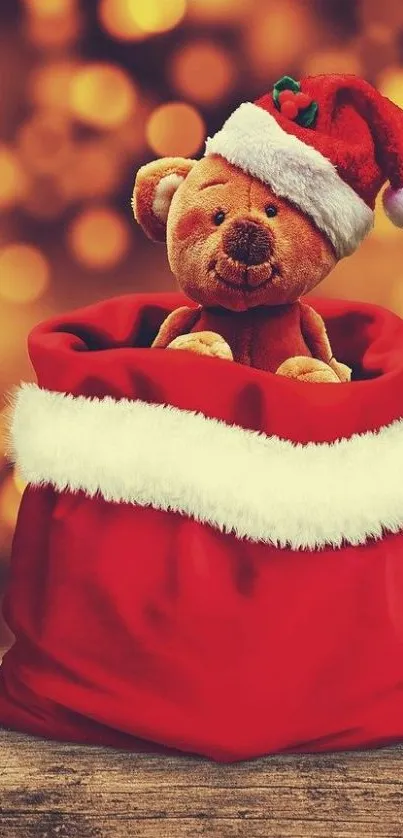 Teddy bear in Santa hat inside red Christmas sack with bokeh background.