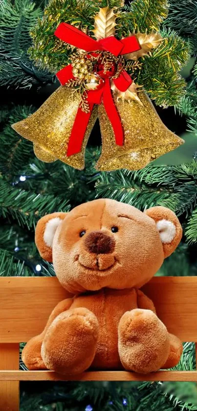 Teddy bear sits under golden bells on a pine-decorated bench.