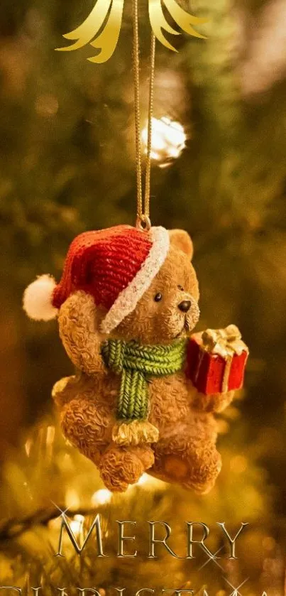 Teddy bear ornament on Christmas tree with lights and gift.