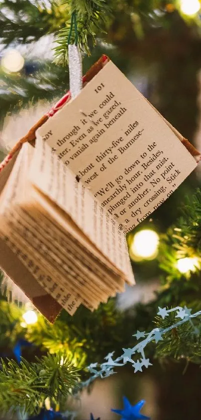 Christmas tree with book ornament and lights.