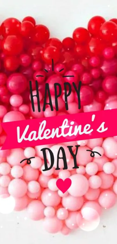 Heart-shaped Valentine's Day wallpaper with red and pink bubble design.