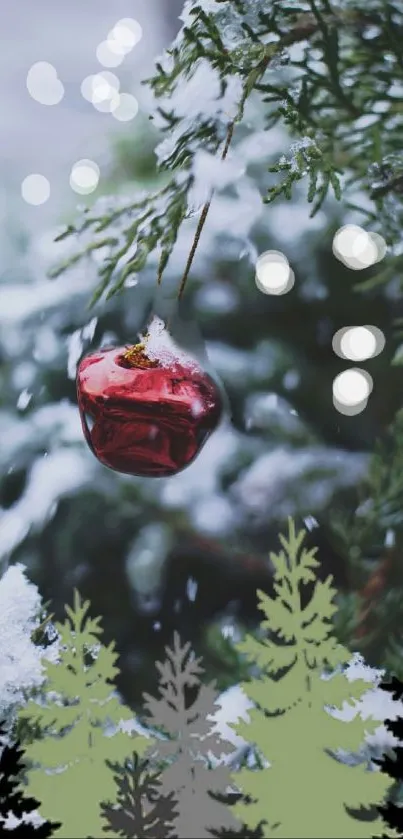 Red ornament hanging on snow-covered branch.