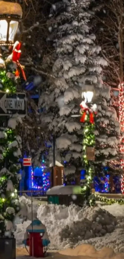 Snowy festive street scene with illuminated decorations.