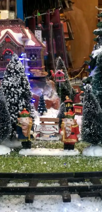 Festive village display with snowy trees.