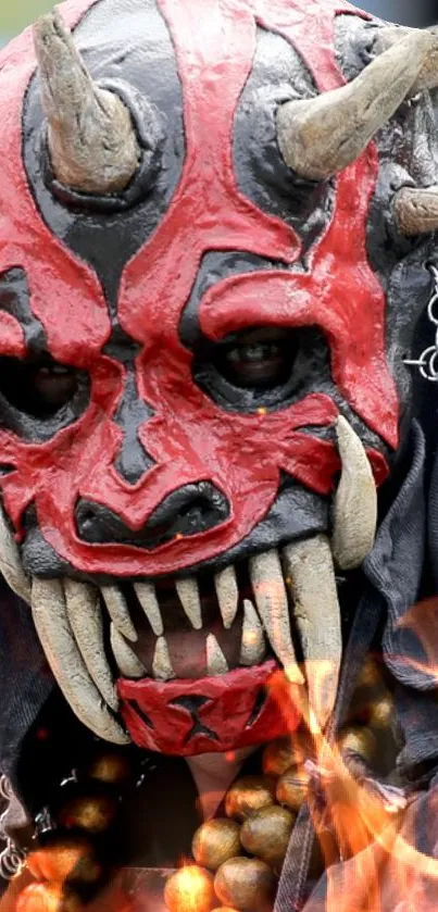 Fiery devil mask with horns and chains in vibrant red and black design.