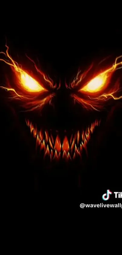 Sinister face with fiery eyes and sharp teeth on a dark background.