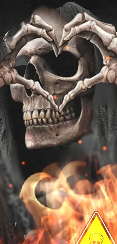 Skull with heart-shaped hands and flames mobile wallpaper image.