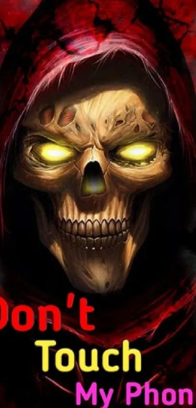 Dark hooded skull with glowing eyes wallpaper
