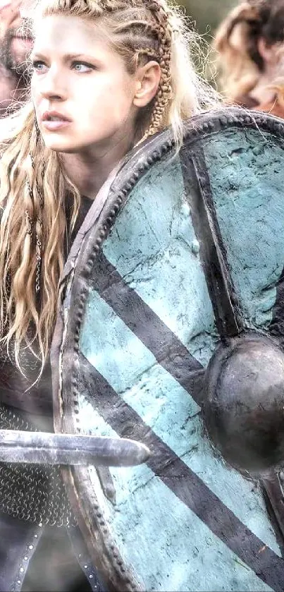 Fierce Viking warrior with historic shield in battle stance.