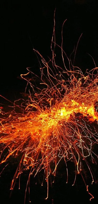 Abstract fiery sparks on a dark background wallpaper.