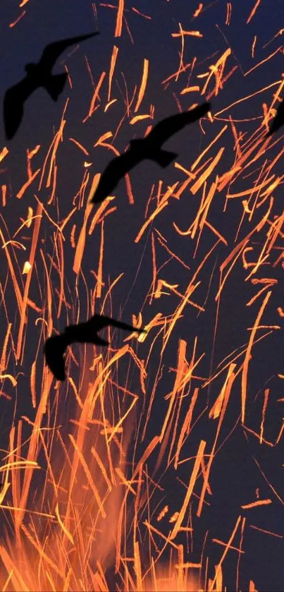 Silhouette birds flying among fiery sparks.