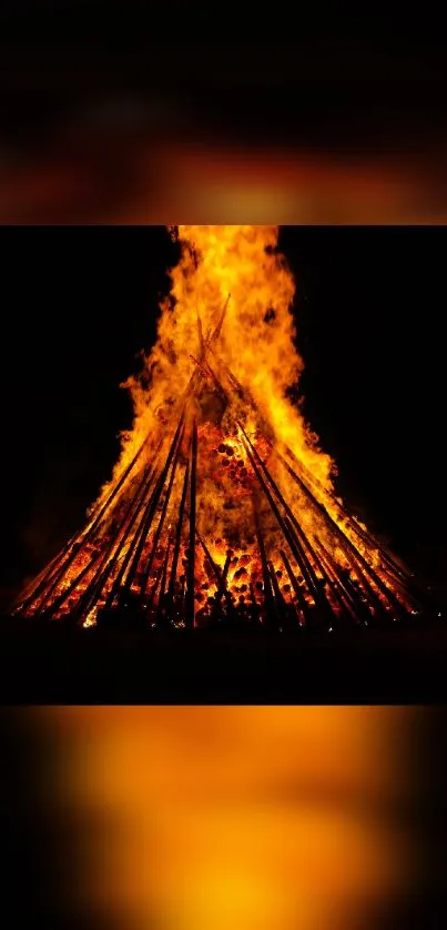 A vibrant bonfire illuminating the night sky.