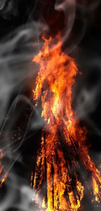 Dynamic fiery bonfire with swirling smoke as mobile wallpaper.