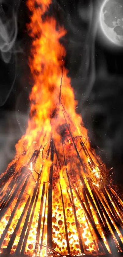 Mobile wallpaper of blazing bonfire beneath a quiet moonlit sky.