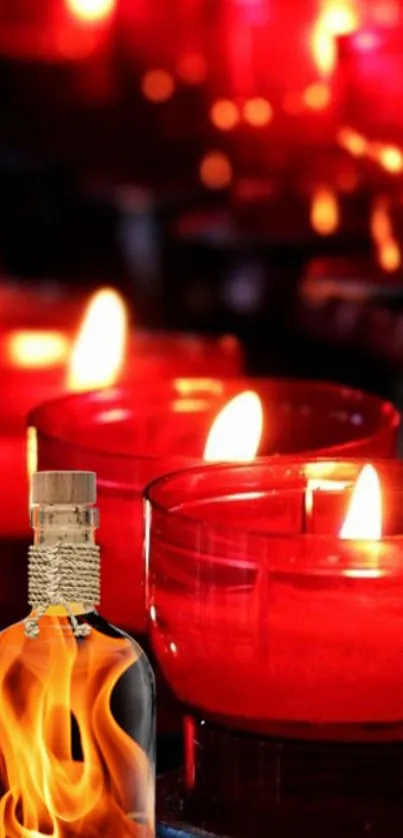 Close-up of red candles and a fiery bottle with flames.