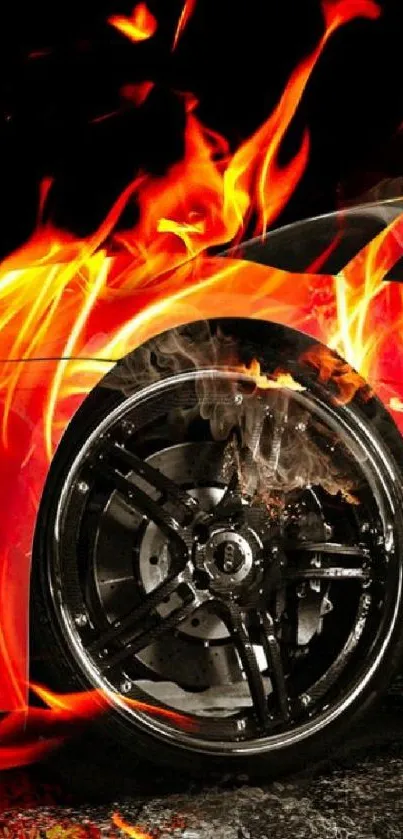 A car wheel surrounded by intense orange flames, creating a dynamic wallpaper design.