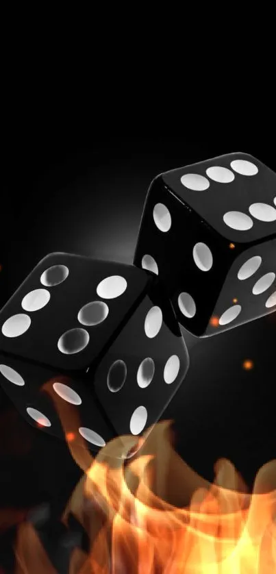 Two black dice surrounded by vibrant flames against a black background.