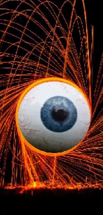 Fiery eye with orange streaks on dark background wallpaper.