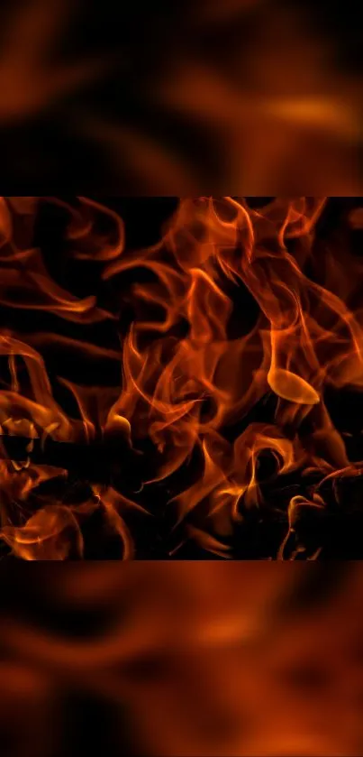 Vibrant orange flames wallpaper with a dark backdrop.