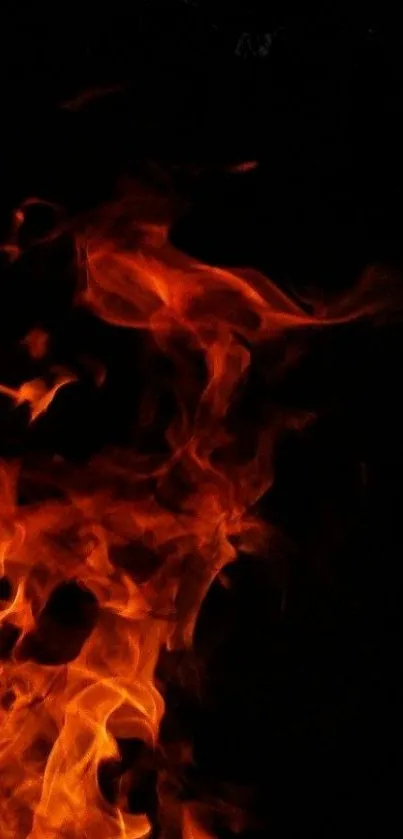 Fiery flames against a dark background, perfect for phone wallpaper.