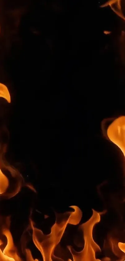 Vivid orange flames creating an intense mobile wallpaper.