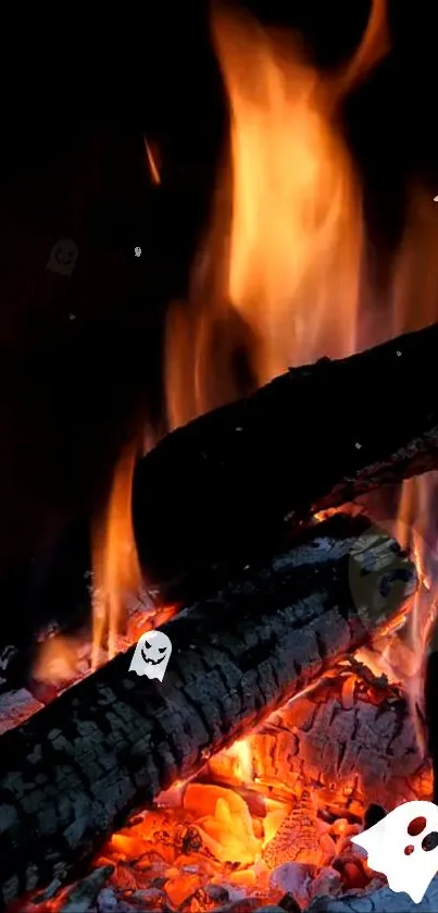 Animated ghosts and fire logs wallpaper with bright orange flames