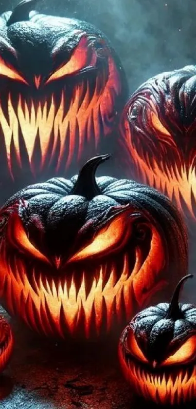 Fiery pumpkins with sinister faces on a Halloween-themed mobile wallpaper.