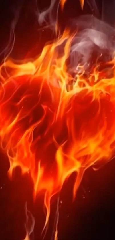 Fiery heart engulfed in vibrant flames on a dark background.