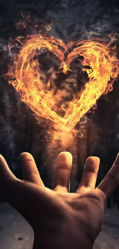 Fiery heart above a hand in a mystical forest wallpaper.