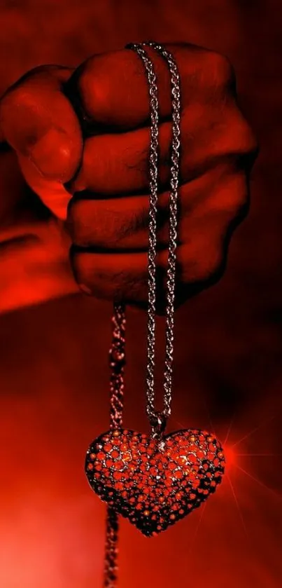 Hand gripping chain with fiery heart pendant, red glow background.