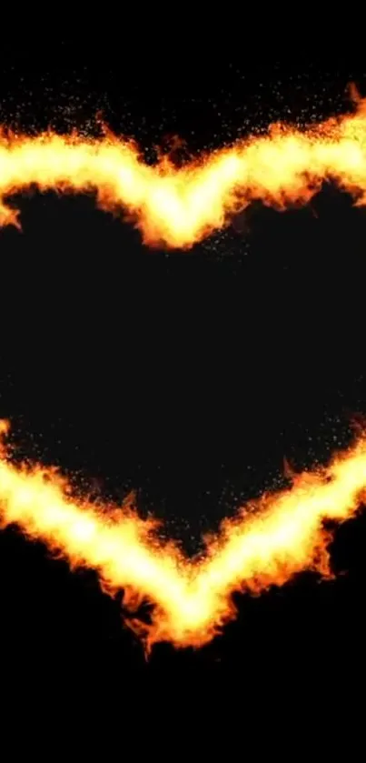 Fiery heart in flames against black background.