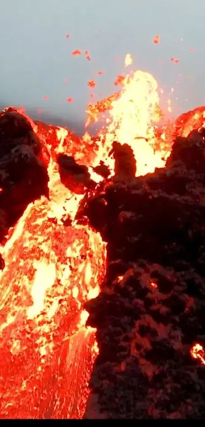 Vivid mobile wallpaper of a fiery lava eruption with bright orange and red hues.