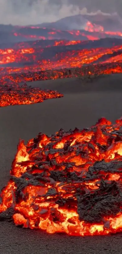 Mobile wallpaper of a glowing lava flow from a volcanic eruption.