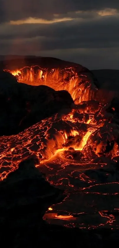 Molten lava flowing from a volcanic crater, illuminating the dark landscape.