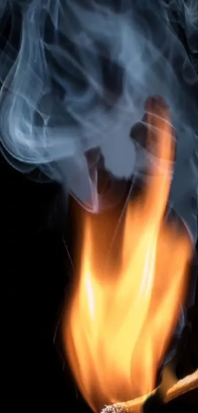 Bright flame and smoke on black background wallpaper.