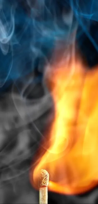 Close-up of a lit matchstick with orange flames and blue smoke on black background.