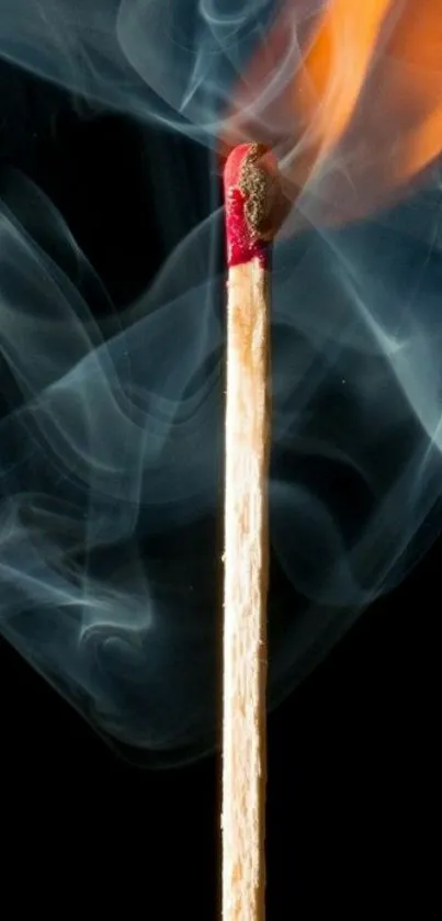 A matchstick igniting with flames and swirling smoke against a dark background.