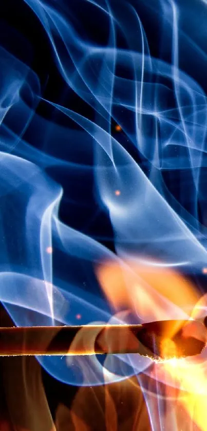 Burning matchstick with flames and swirling blue smoke wallpaper.