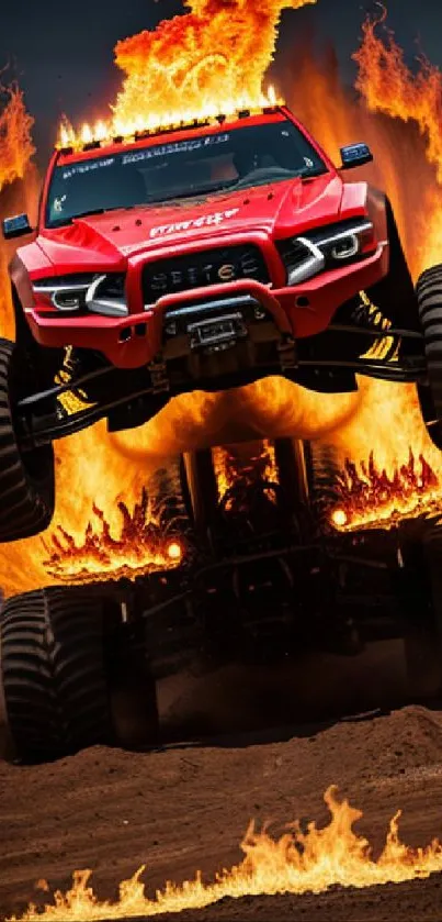 A red monster truck jumps through flames against a dramatic sky.