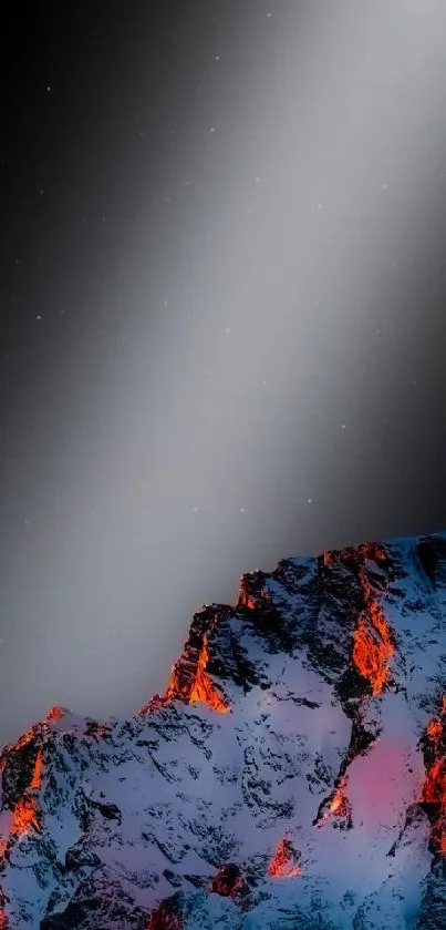 Wallpaper of glowing fiery peaks against a dark night sky.