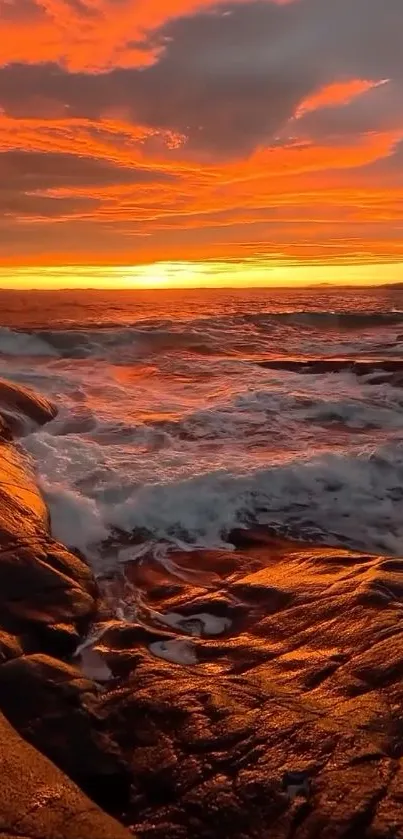 Vibrant fiery ocean sunset with waves crashing.