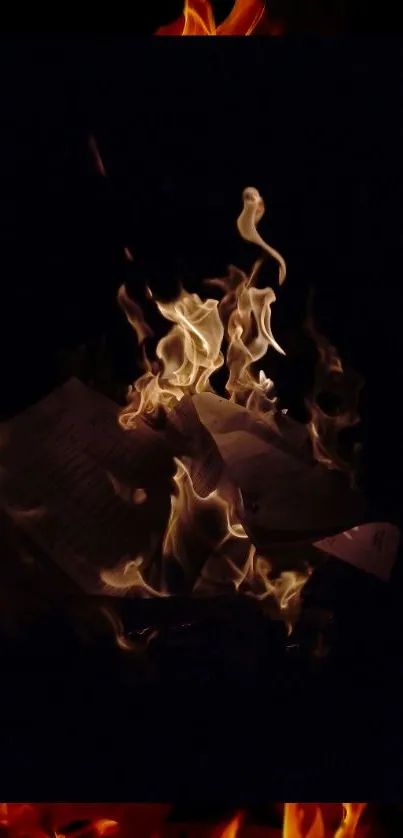 Burning papers surrounded by dark flames, creating a dramatic wallpaper effect.