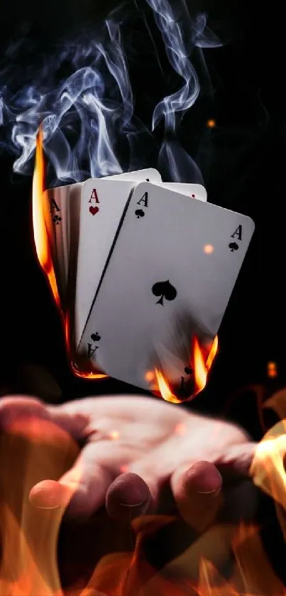 Burning poker aces floating above a hand.