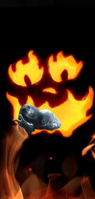 Fiery pumpkin face with flames and spooky figure.