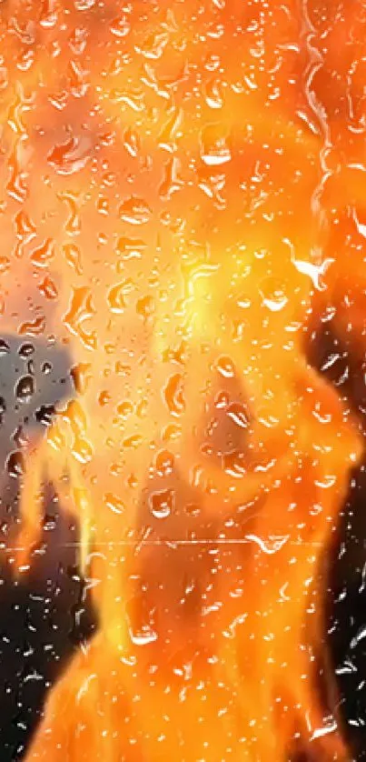 Fiery orange flames with raindrops on glass.