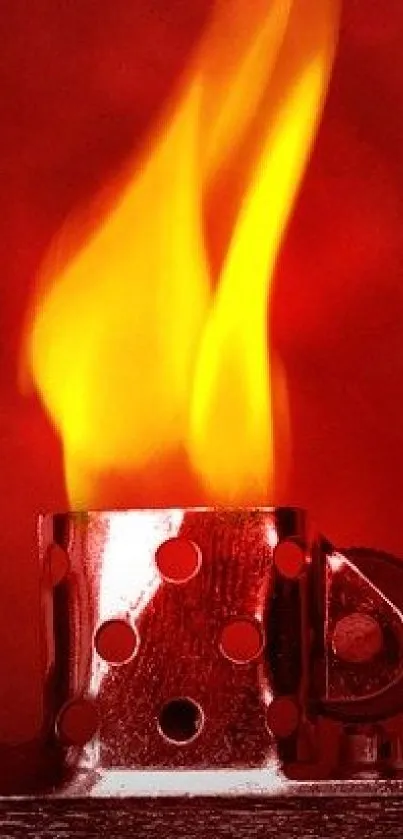 Fiery red lighter with vivid flame against a deep red background.