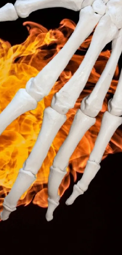 A skeleton hand with vibrant flames on a dark background.